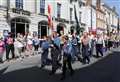 Scouts march to celebrate their patron saint