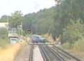 Train hurtles over crossing with barriers still up