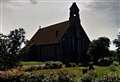 Gun recovered after body found in churchyard