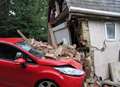 Car smashes into house