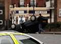 Car flips on its roof in town centre