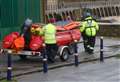 Trio rescued after getting stuck in mud