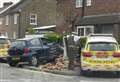 Police car and Toyota demolish garden wall