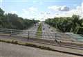 Yobs throw stone from motorway bridge