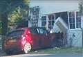 Emergency services called after car ploughs into house