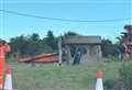 Digger flips over on roundabout