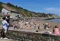 Thousands flock to beaches as temperatures soar