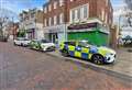 Police spotted on roof in high street after area cordoned off