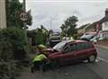 Road blocked after car hits post