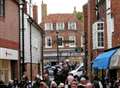 Fun-loving festival crowds brave downpours