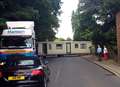 Delays as mobile home blocks road