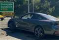 Close call for BMW driver at roundabout