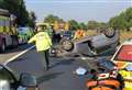 Delays as car overturns