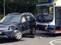 Debris flies as bus and car collide 