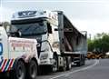 Road closed for several hours after lorry overturns