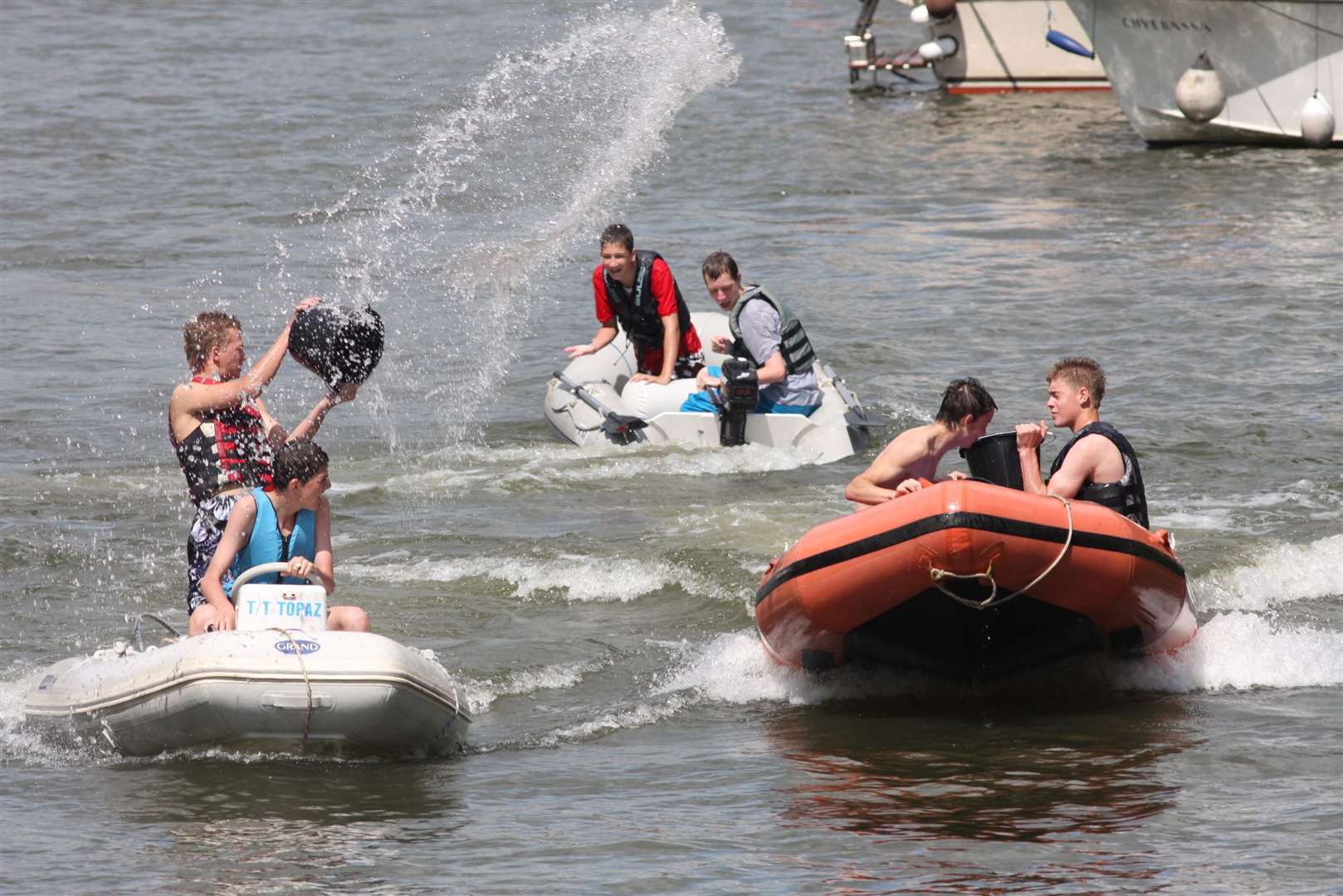 People on boats throwing buckets of water over the other dingies during the River Festival 2009. Picture: John Westhrop