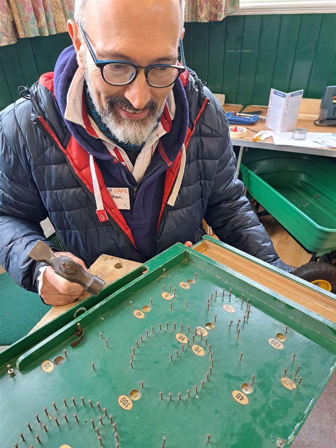 Dr Jonathan Wentzel fixing Cllr Springett's bagatelle