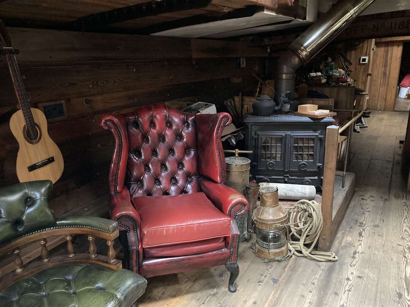 Comfy chair, wood-burning stove and guitar. What more do you need?