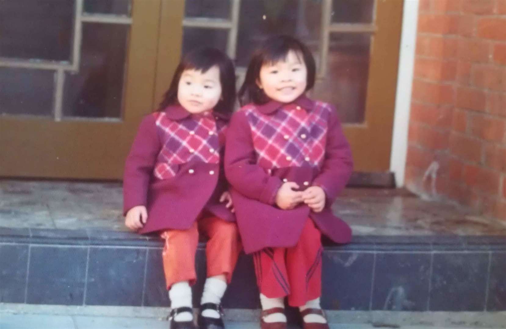 (L-R) Gar Lai and Gar Wai, owner Yuk Tong Chiang's daughters, sitting on the steps of the restaurants in the 70s. Picture: Wai Chiang