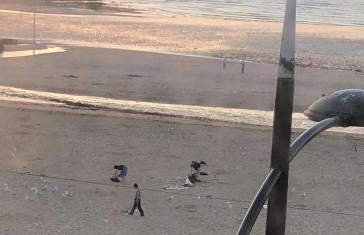 A group littered picked after a busy day at the beach. Pic: Jordan Rowe (2821432)