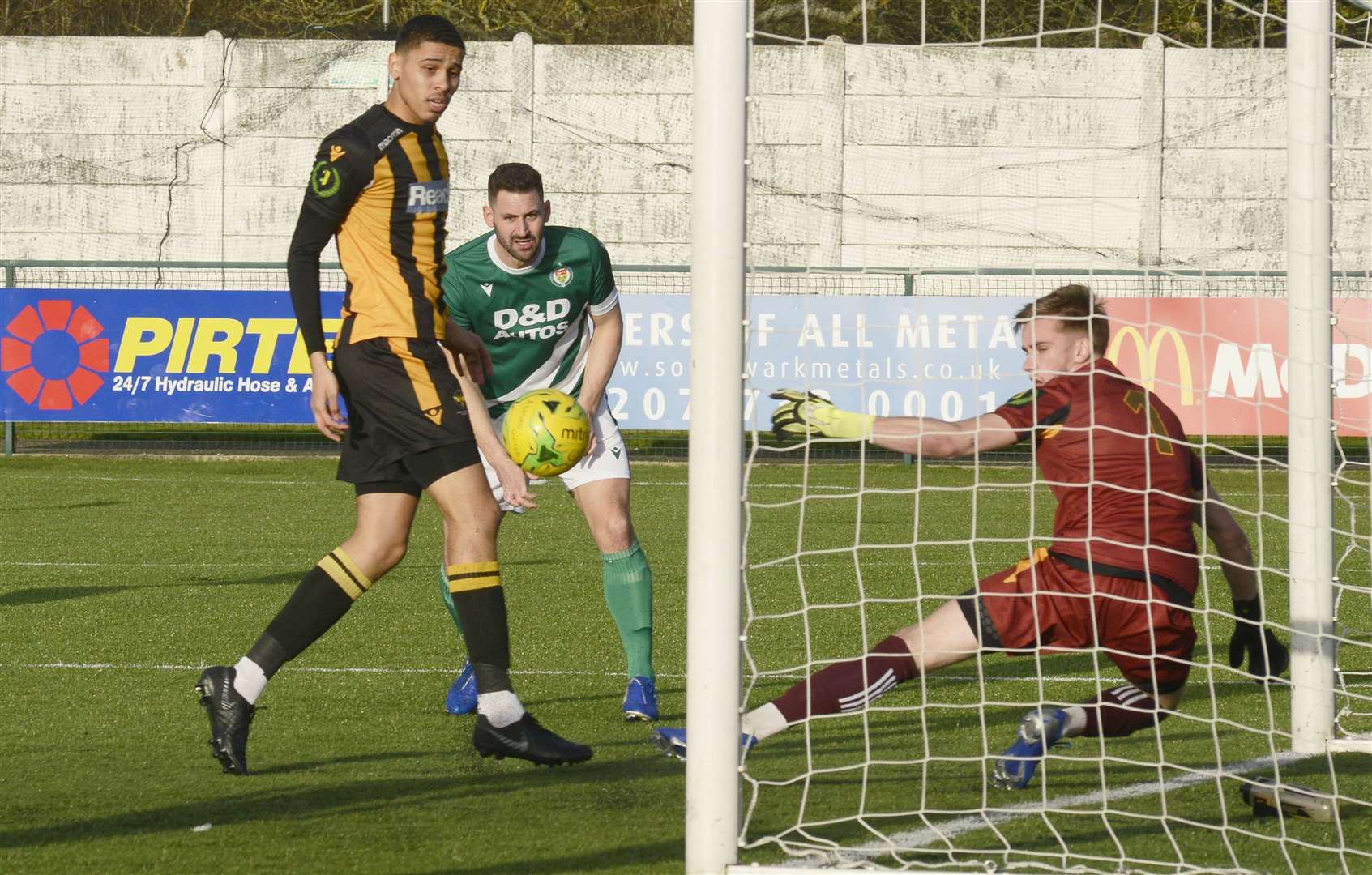 Jay May heads in Ashford's first goal against East Grinstead Picture: Paul Amos