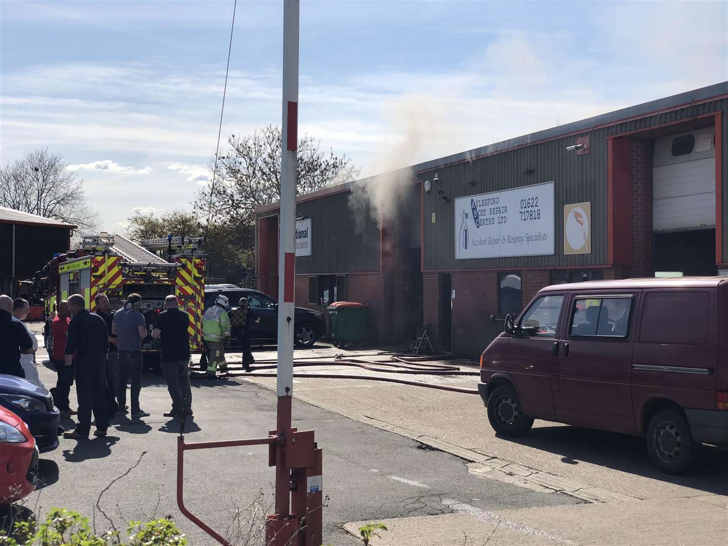 Smoke Billowed from the door of the car body repair shop. Picture: Ryan Roser. (1407164)