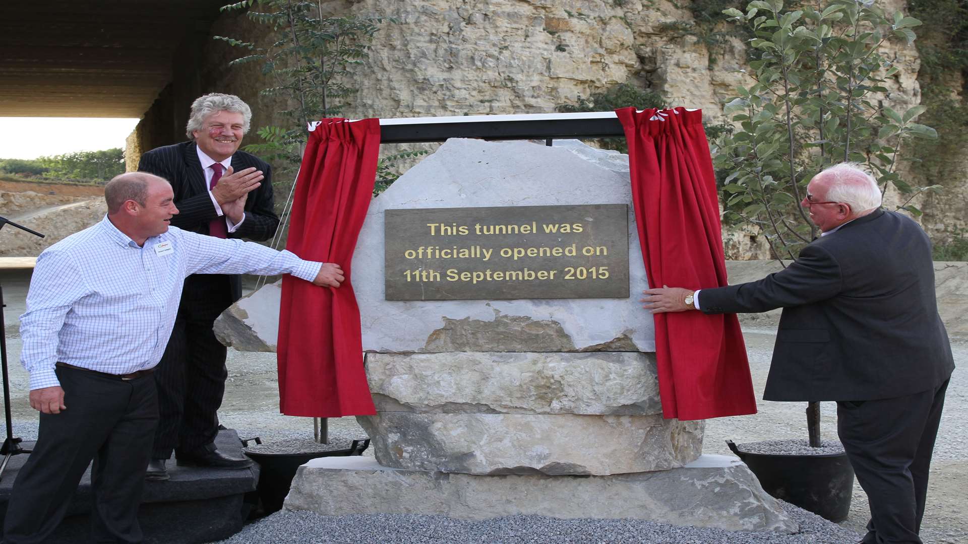 Paul D'Arcy, Mark Dance and Pat Gallagher unveil the new plaque at the tunnel