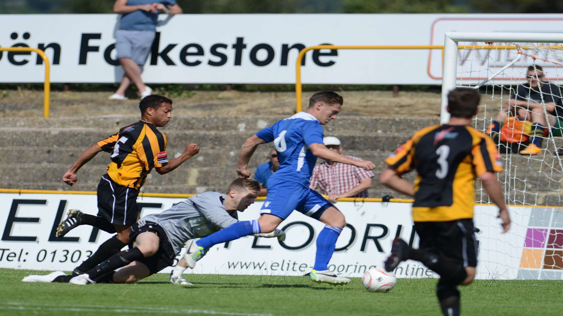 Andy Pugh rounds Tim Roberts to score Dartford's first goal Picture: Gary Browne