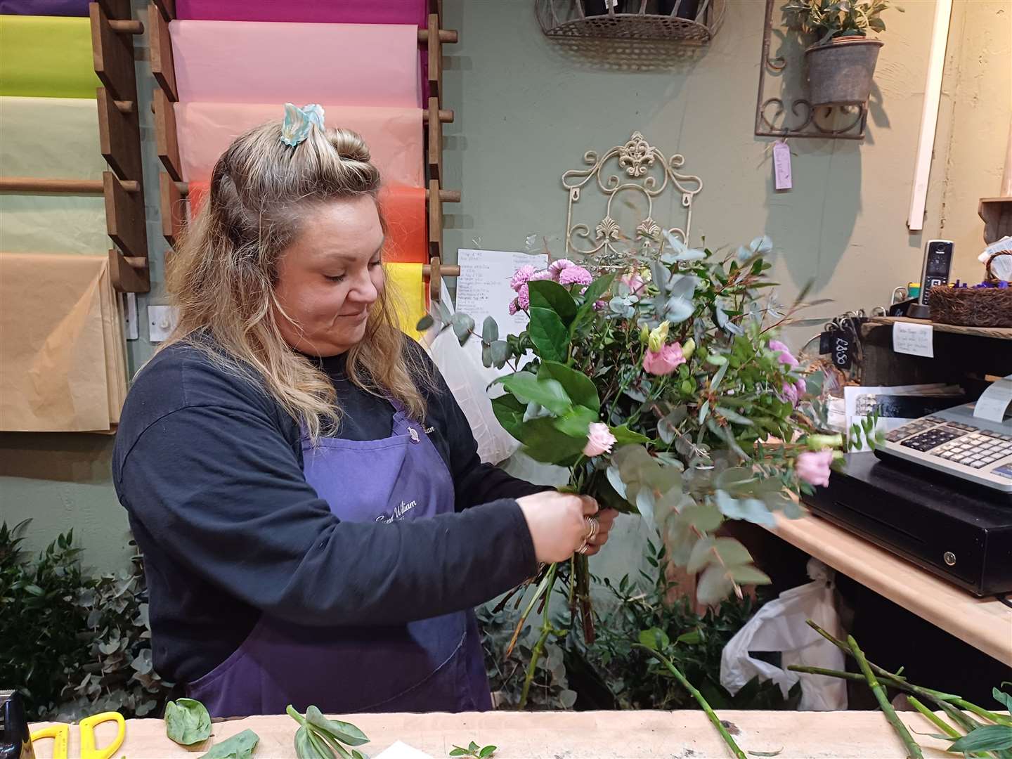 Senior florist Lauren Jones creating a pretty bouquet for Mother's Day