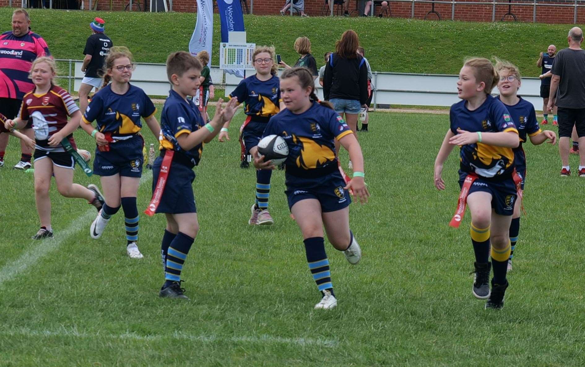 Sophia Kelly, joint captain of the under-15s, breaks away with her fellow captain, Rory Appleton, in support at the Wooden Spoon International Tag Rugby Festival. Picture: Wooden Spoon