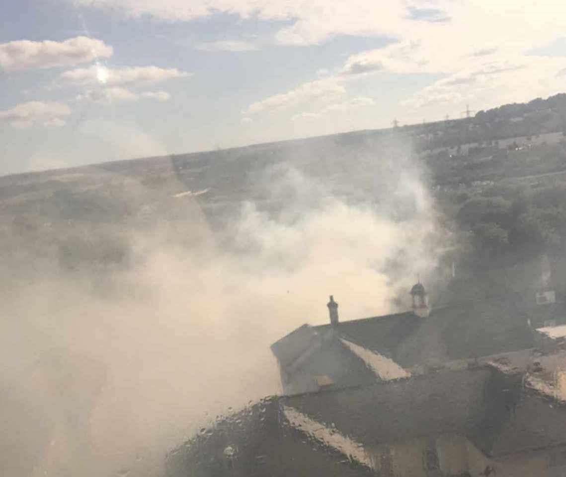 Smoke billowing from a house fire in Rose Street. Images: Paige Mckee