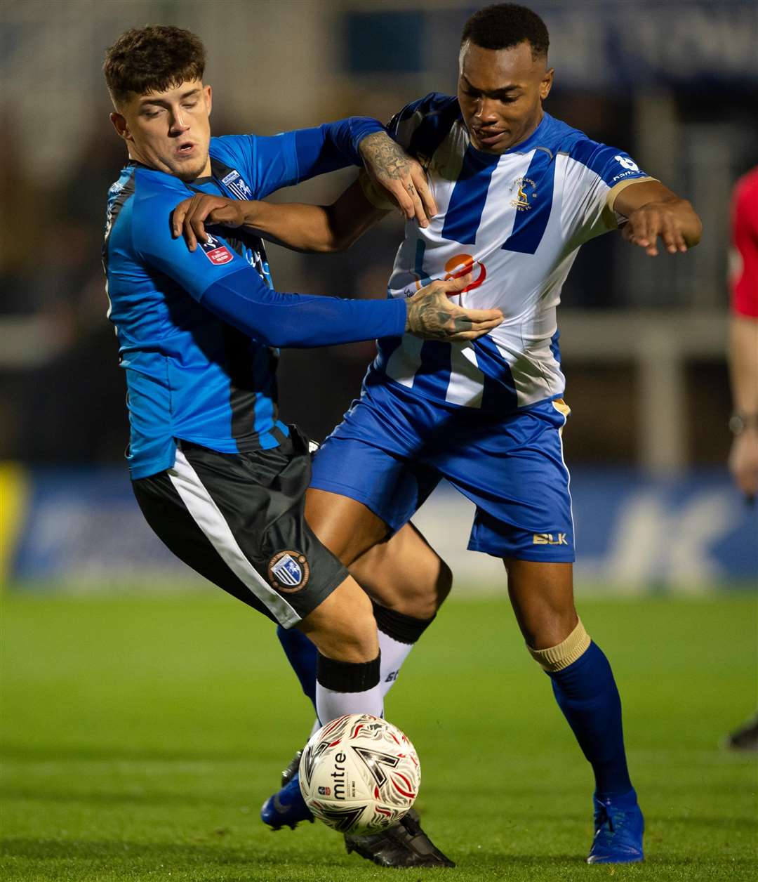 Darren Oldaker challenges with Marcus Dinanga. Picture: Ady Kerry