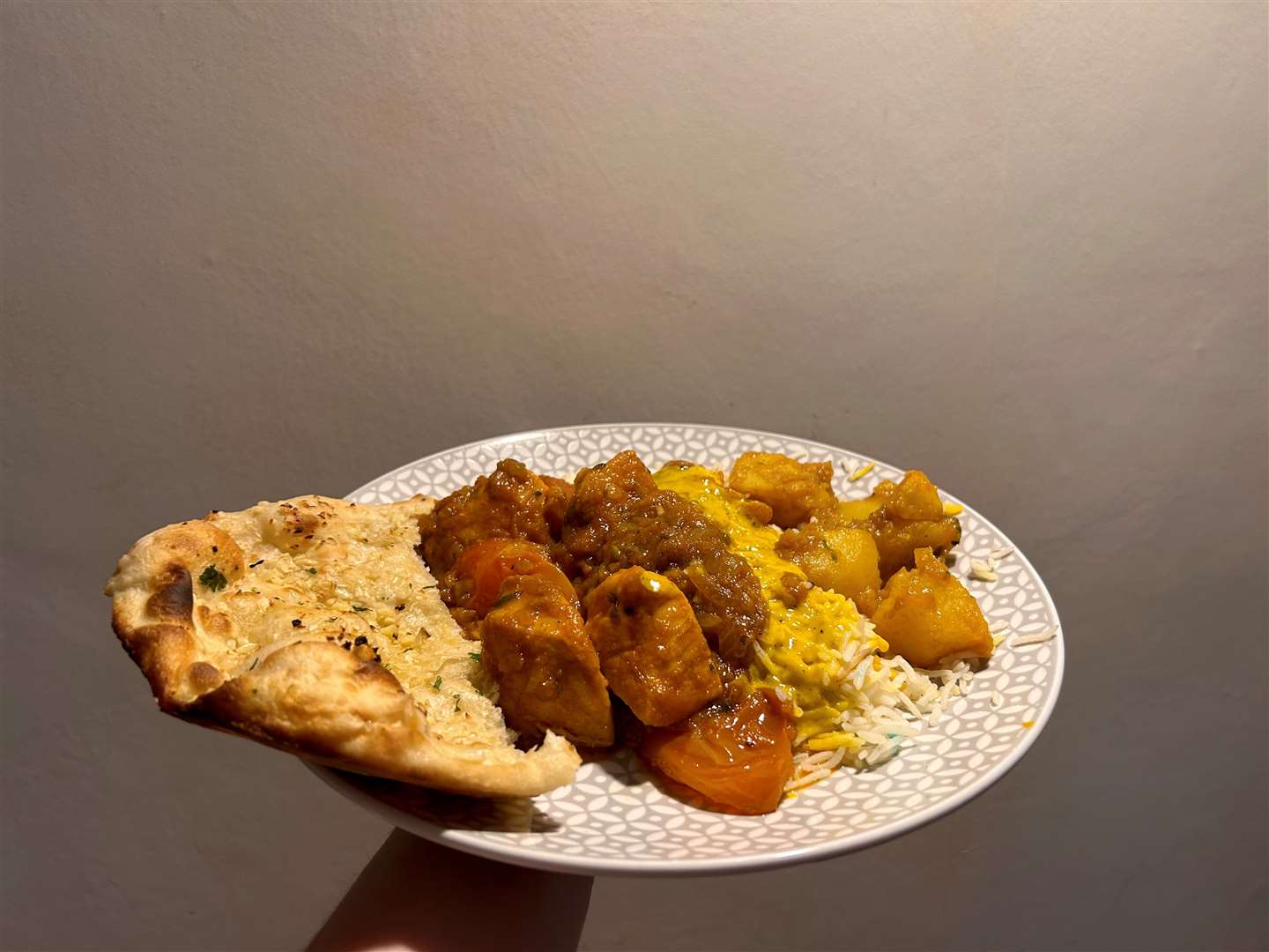 Garlic naan, chicken patia, egg fried rice, bombay potatoes