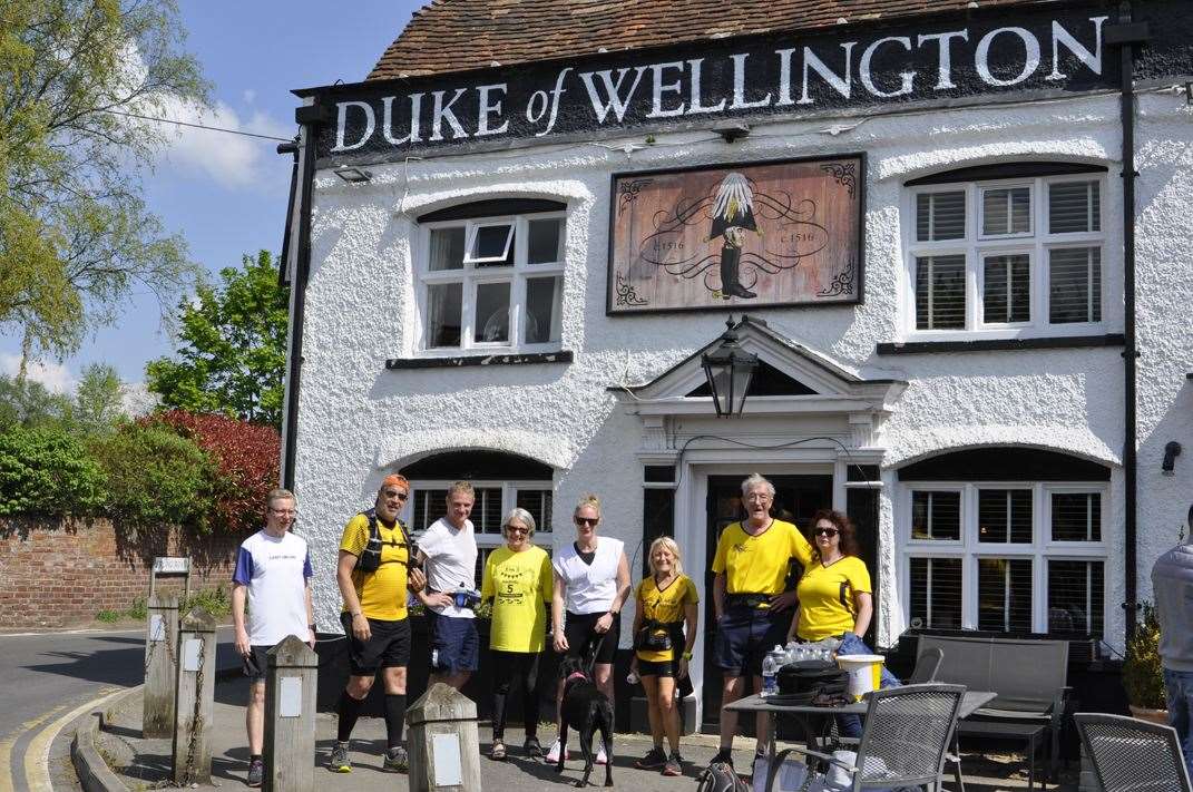 The group of runners had a cheer point at the Duke of Wellington pub in Ryarsh. Picture: Deke Martin