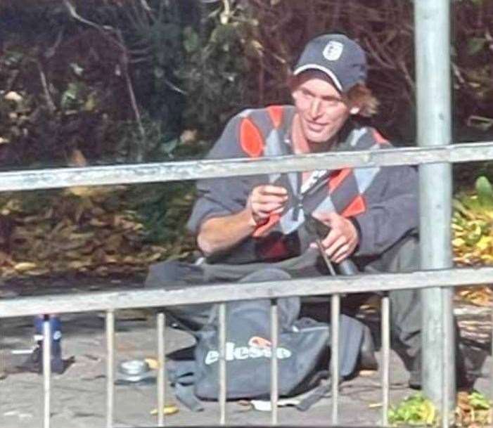 Daniel Munn loading the weapon gun outside Domino's in Canterbury. Picture: CPS South East