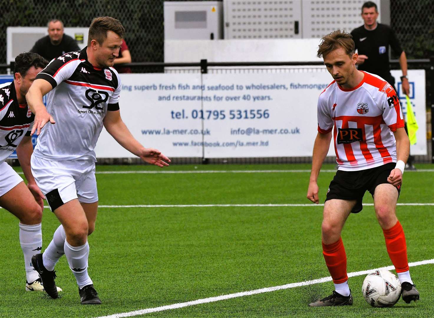 Faversham defender Callum Davies pays close attention to Sheppey's Jacob Lambert. Picture: Marc Richards