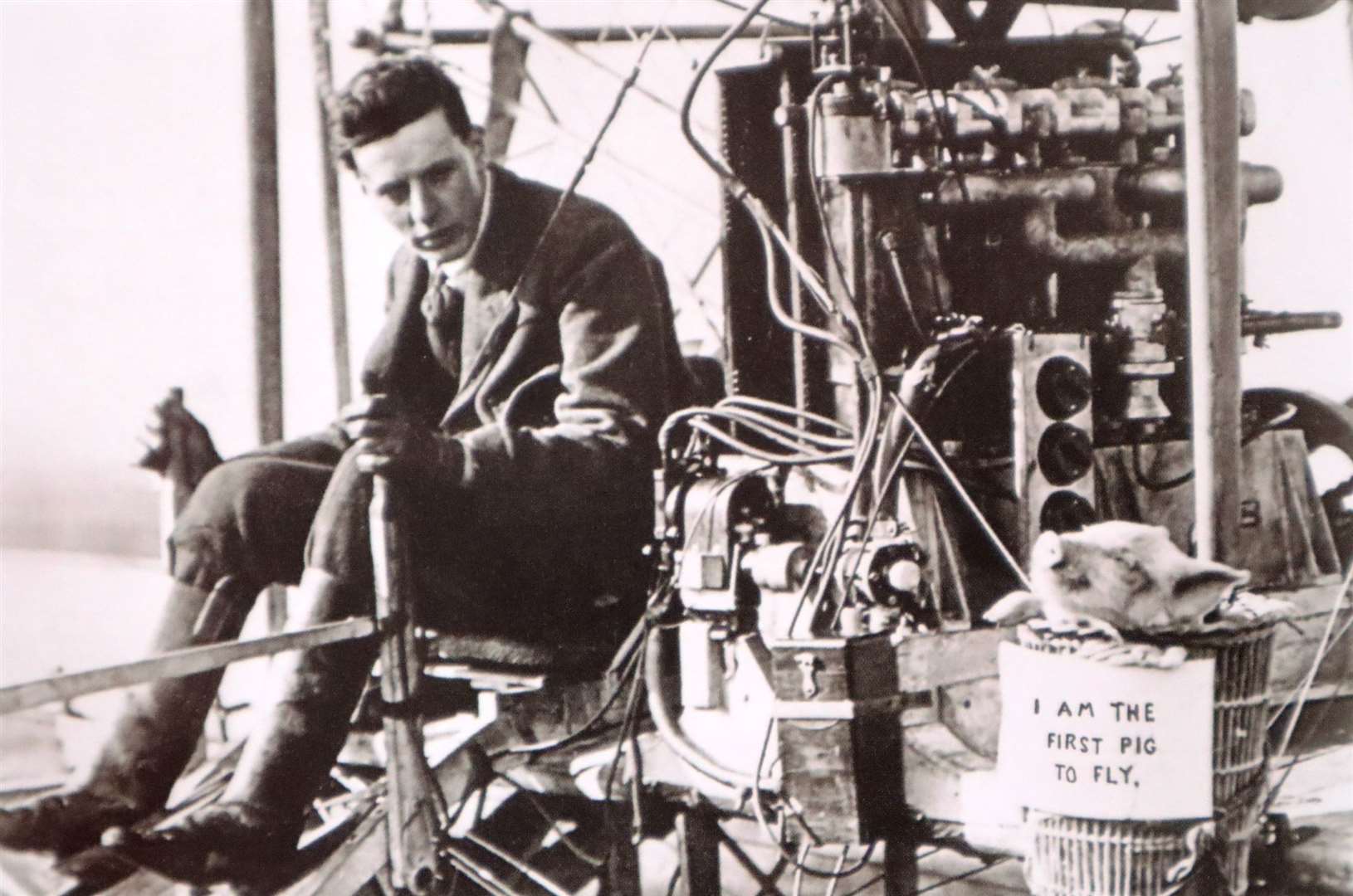 John Moore-Brabazon with a pig called 'Icarus II' about to take flight in a Short Brother's biplane. Shelllbeach, November 5, 1909. Picture: A History of Sheppey in Pictures by Chris Reed