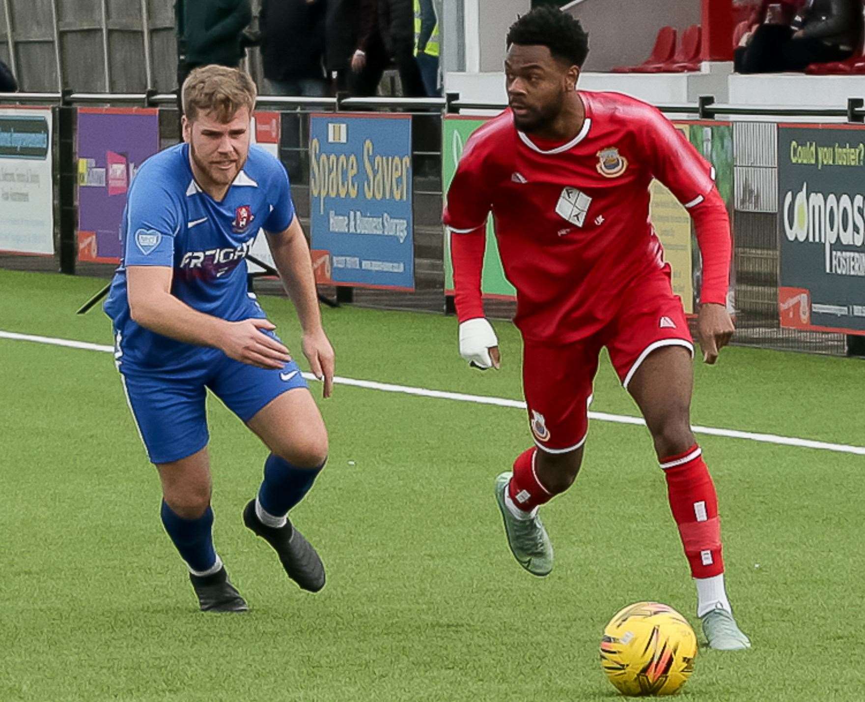 Josh Williams speeds past Dan Tear in Whitstable’s goalless weekend draw with Tunbridge Wells. Picture: Les Biggs