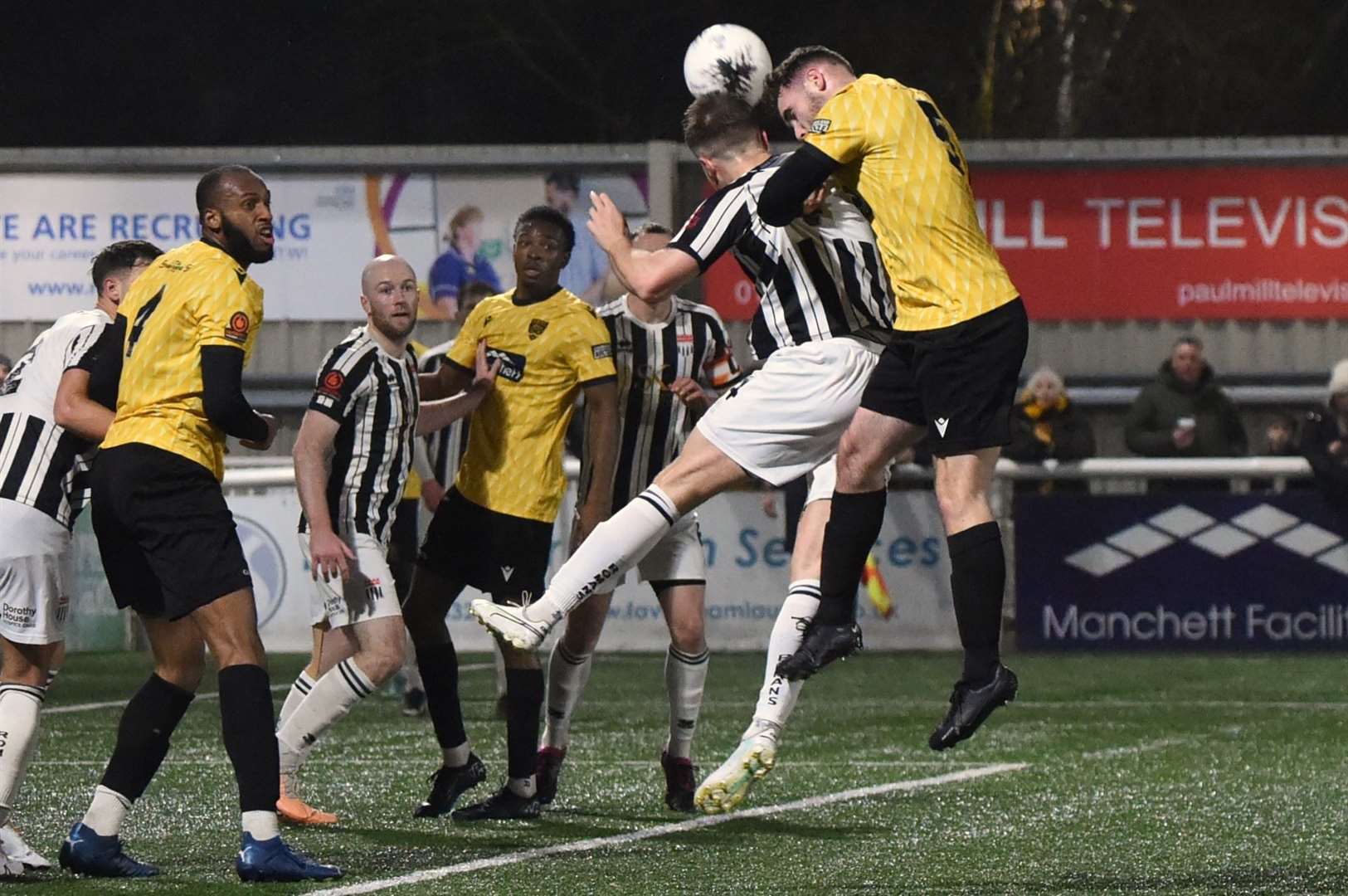 Maidstone defender George Fowler heads goalwards. Picture: Steve Terrell