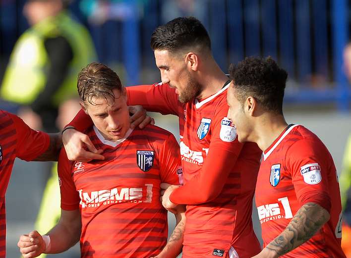 Captain Lee Martin congratulated by Conor Wilkinson after making it 3-1 Picture: Ady Kerry