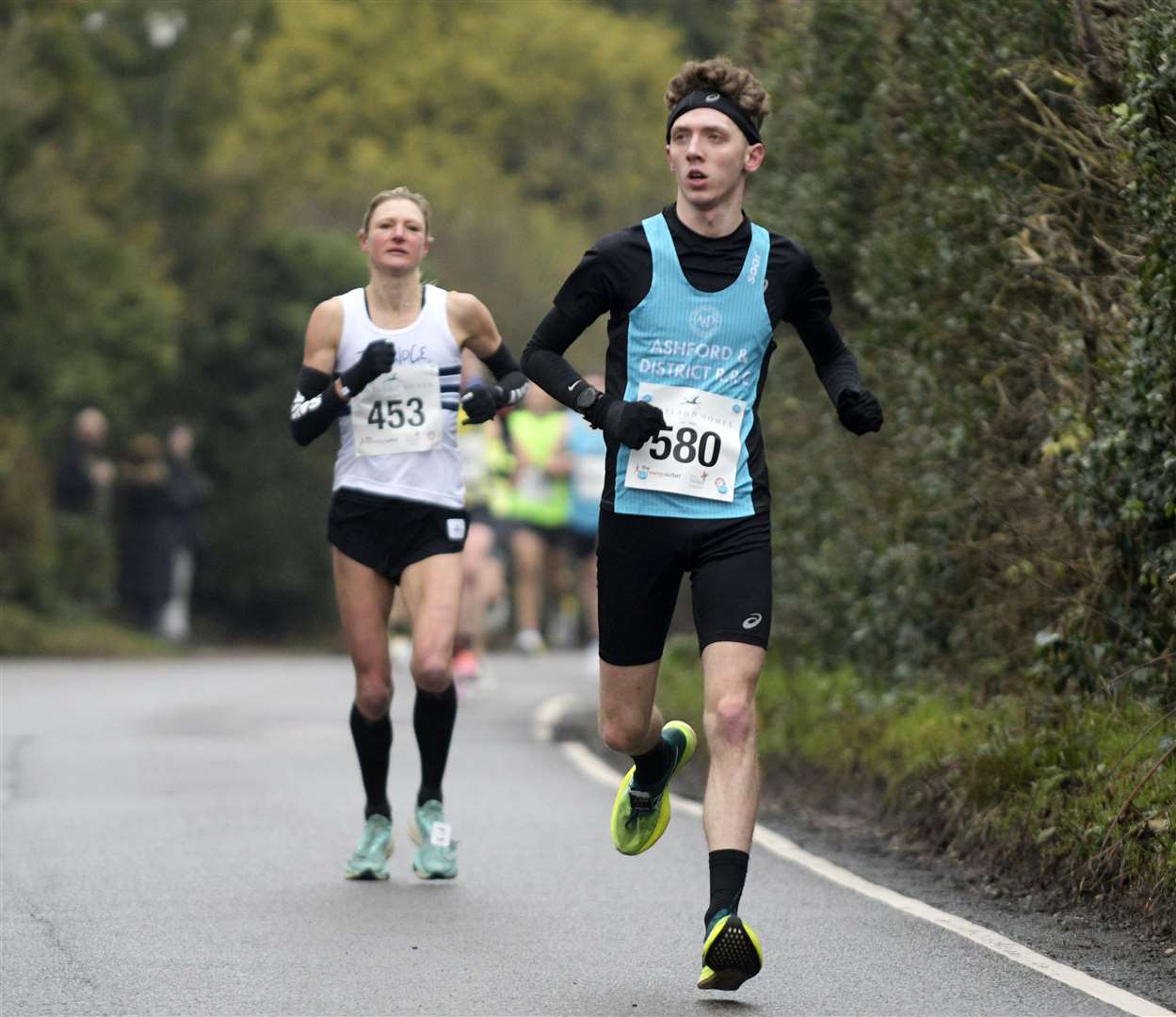 Kieran Hodges running for Ashford & District Road Running Club with Tonbridge AC's Helen Gaunt behind. Picture: Barry Goodwin (62013904)