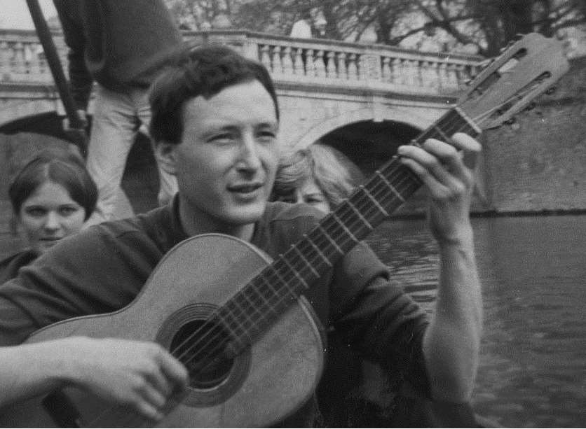 Jean-Philippe Madjar strums his guitar while punting on the River Cam while a student at Cambridge University.