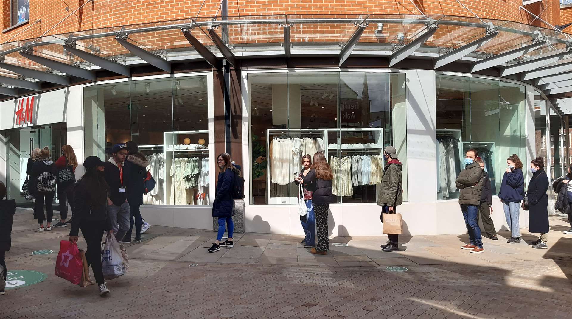 Shoppers queue outside H&M in Fremlin Walk, Maidstone