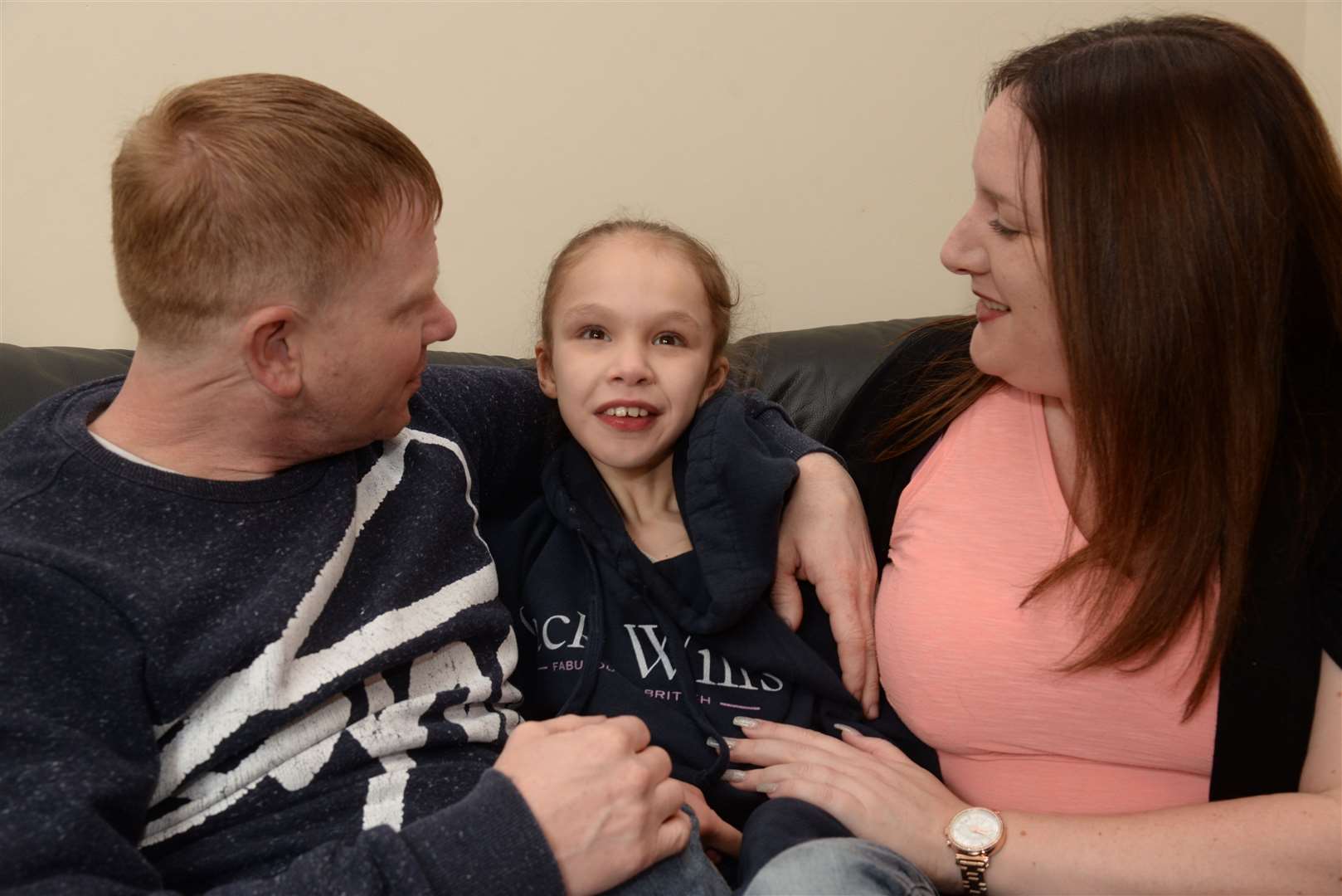 Teagan Appleby with mum Emma and dad Lee Moore. Picture: Chris Davey.