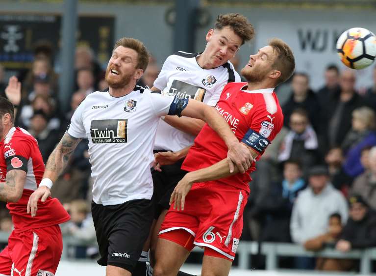 Ellio Bradbrook and Alfie Pavey challenge for the ball against Swindon Picture: Andy Jones