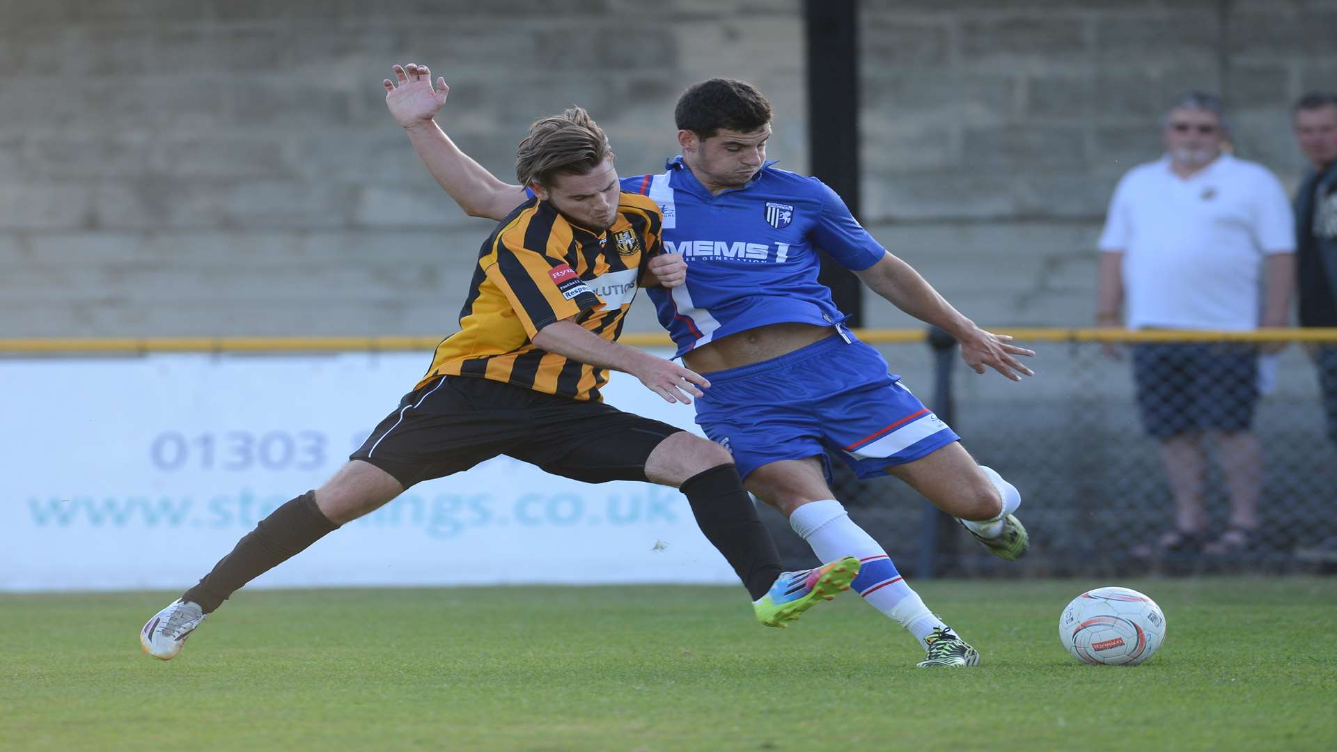 John Egan clears the ball under pressure against Folkestone Picture: Gary Browne