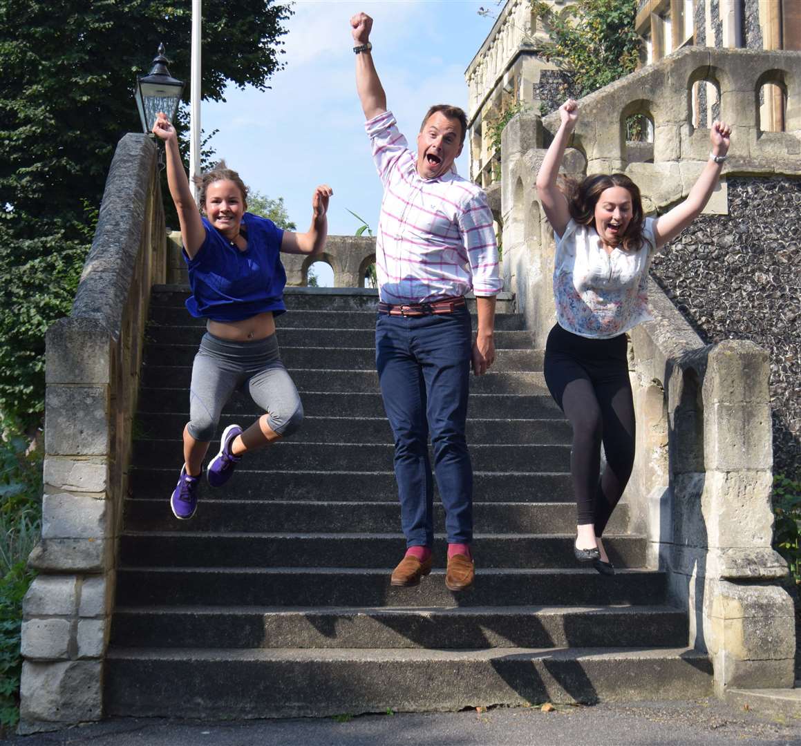 A level results were celebrated at Dover College: Chloe Caskie (in blue) Malandra Rogers with headmaster Gareth Doodes