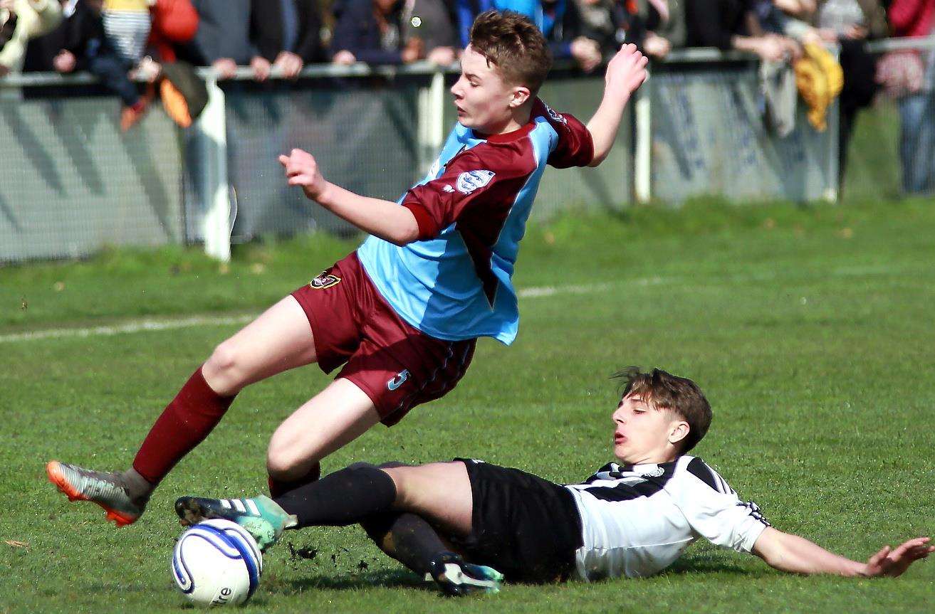 Real 60 Panthers under-14s (white) slide in against Wigmore Youth Whippets under-14s in their John Leeds Trophy final. Picture: Phil Lee FM1496173