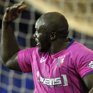 Adebayo Akinfenwa celebrates scoring the second Gillingham goal against Tranmere