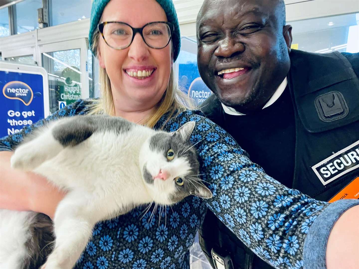 Cllr Charlotte Cornell gets help from Sainsbury's security in capturing the naughty cat. Picture: Charlotte Cornell